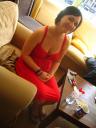 Jaecinta sitting in a red dress