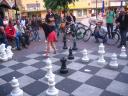 Girl playing street chess